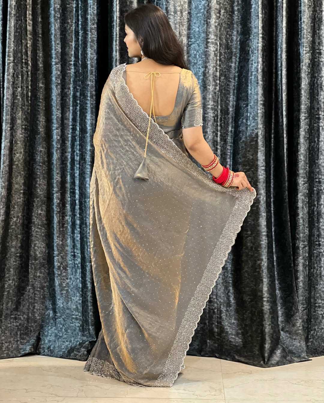 Delicately handcrafted Diamond work silk saree