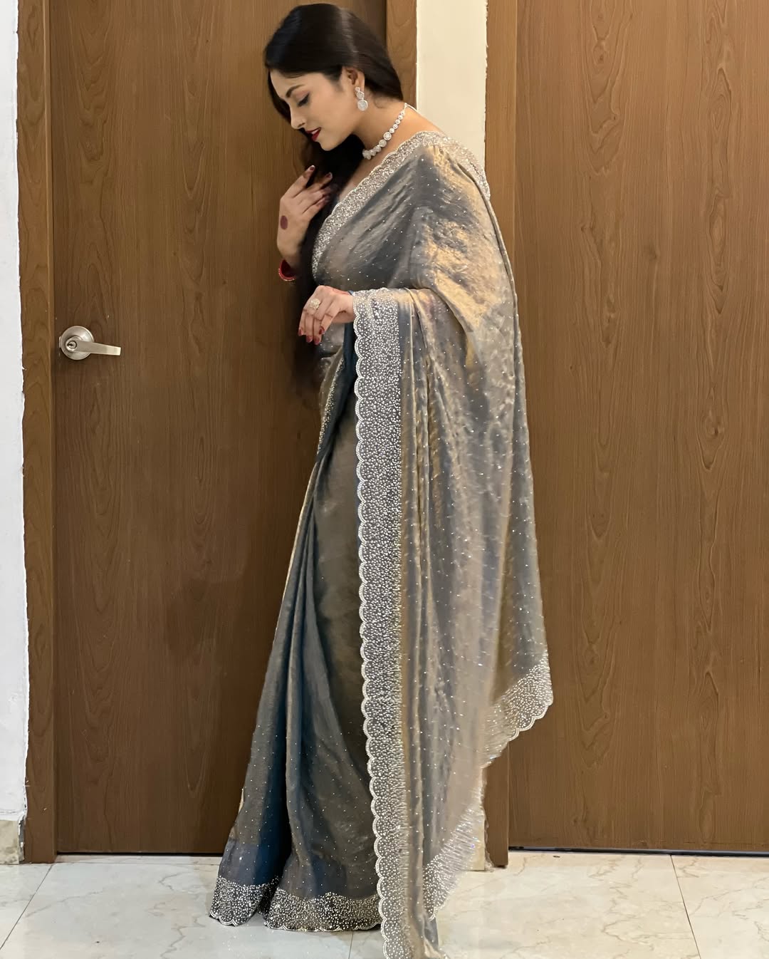 Delicately handcrafted Diamond work silk saree