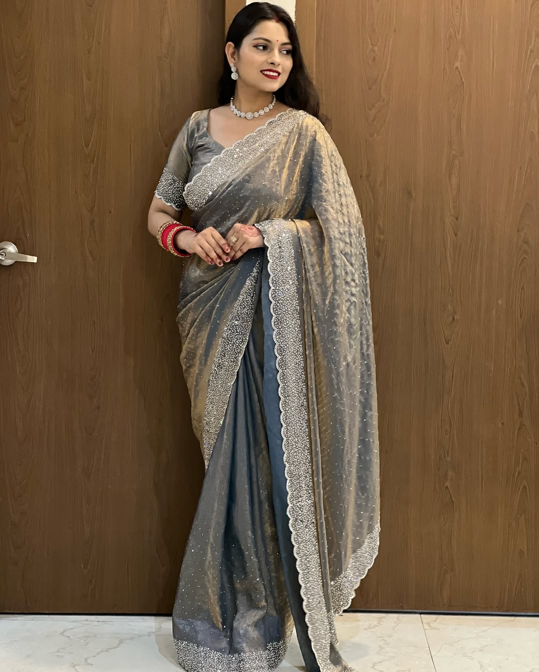 Delicately handcrafted Diamond work silk saree
