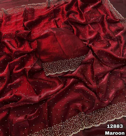 Delicately handcrafted Diamond work silk saree