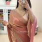 Delicately handcrafted Diamond work bring out the vibrancy of this pink silk saree.