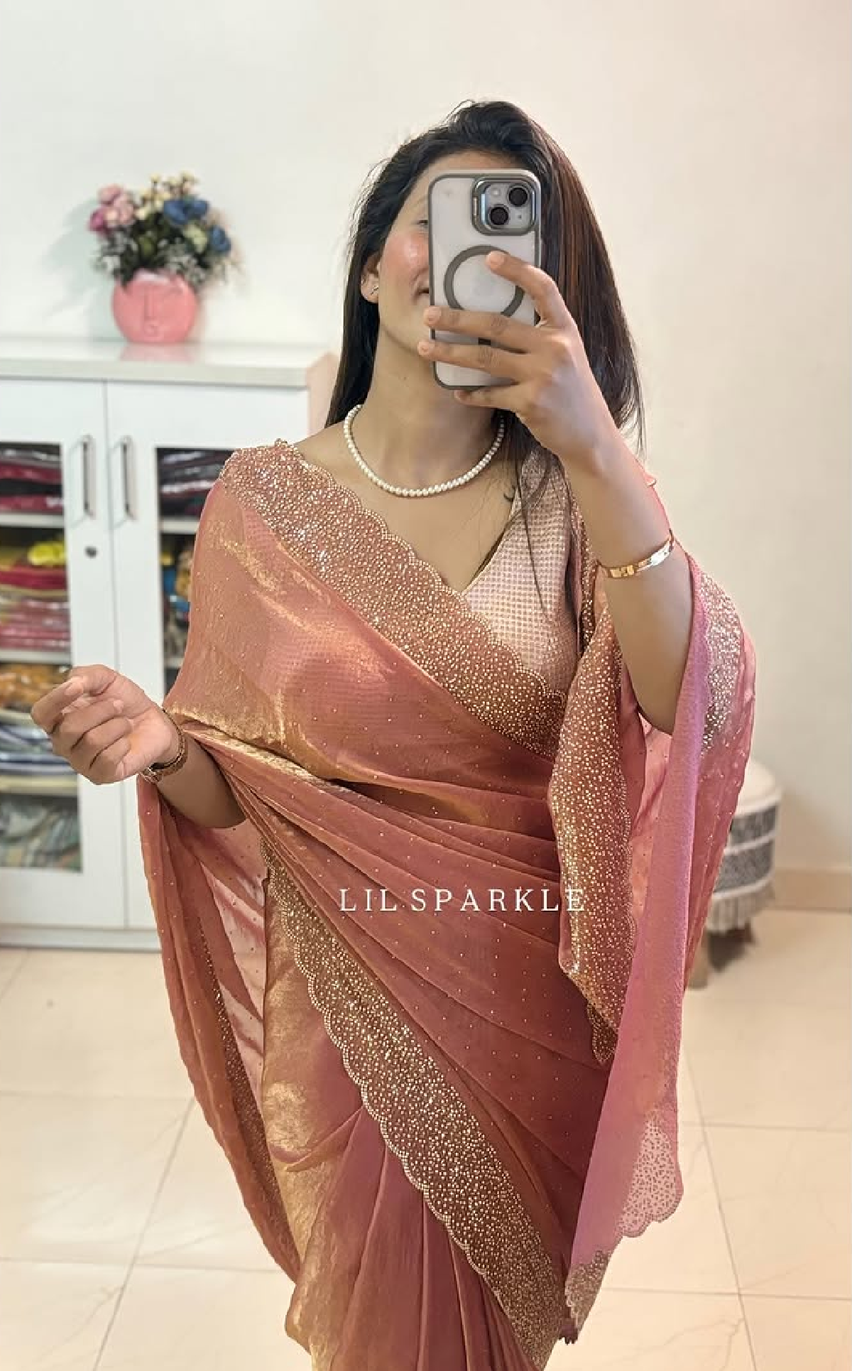 Delicately handcrafted Diamond work bring out the vibrancy of this pink silk saree.