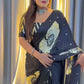The luxurious Japan Satin Silk fabric, beautifully detailed with heavy mirror work