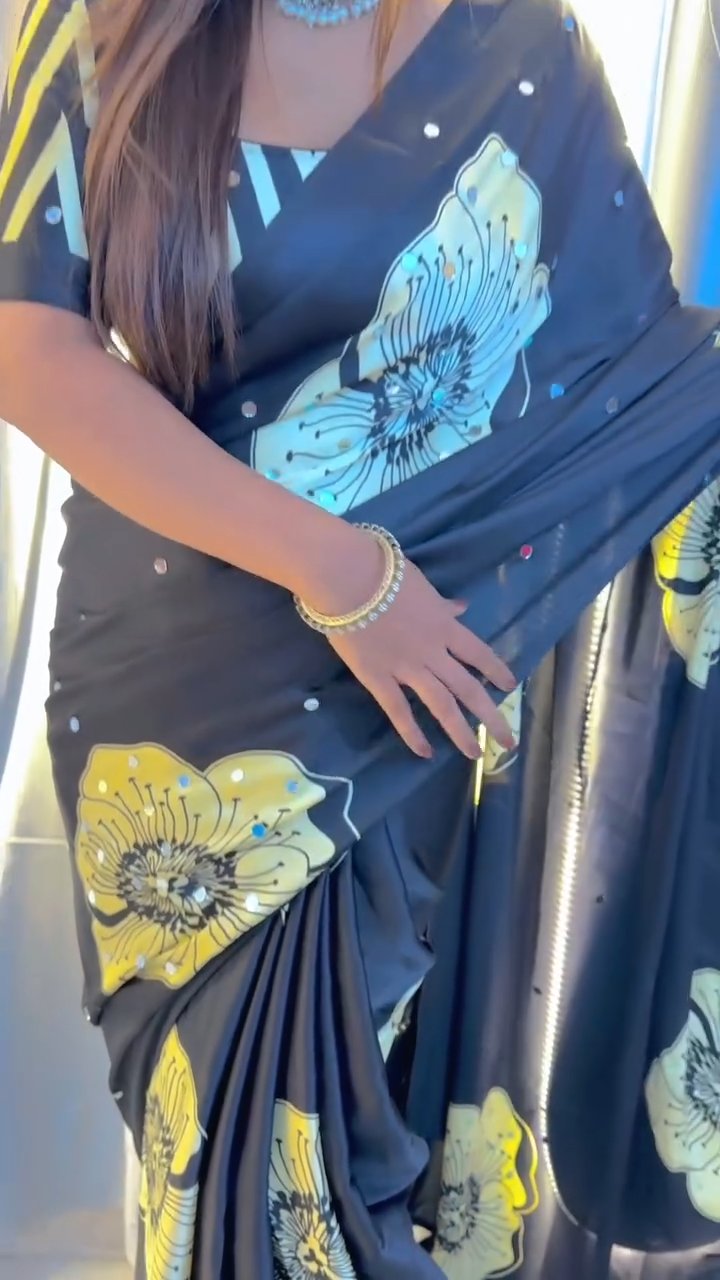 The luxurious Japan Satin Silk fabric, beautifully detailed with heavy mirror work