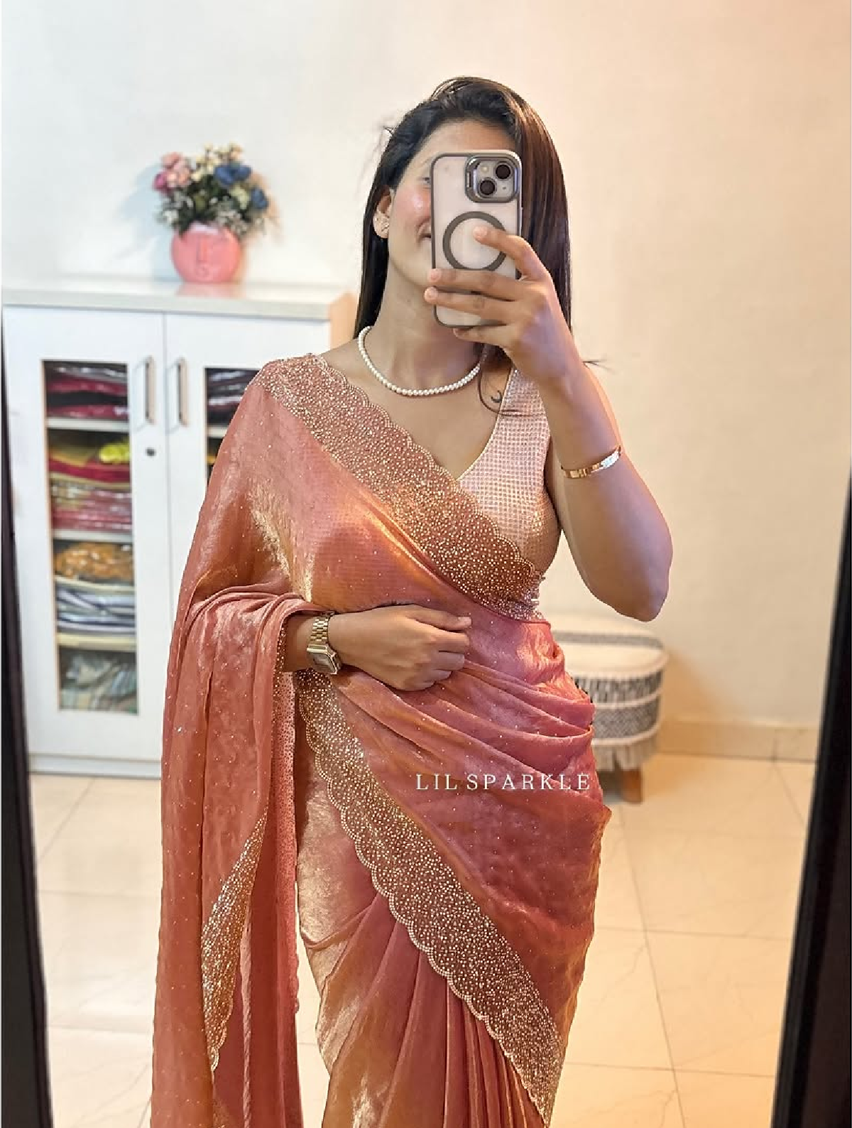 Delicately handcrafted Diamond work bring out the vibrancy of this pink silk saree.