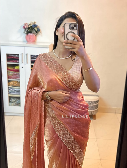 Delicately handcrafted Diamond work bring out the vibrancy of this pink silk saree.